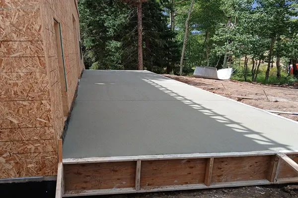 Concrete slab poured against framed walls at a mountain home near Woodland Park and Divide