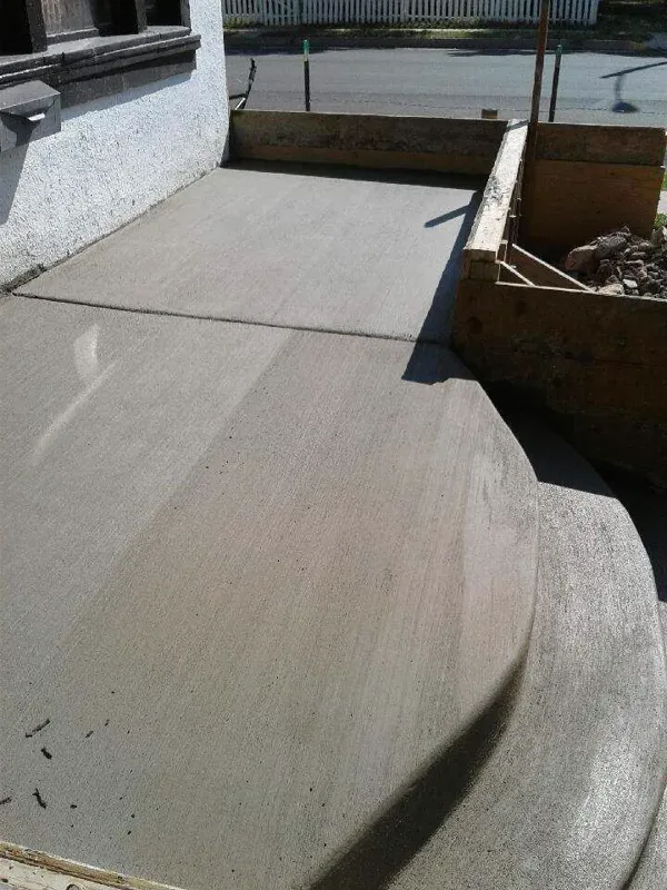 Curved concrete slab poured beside a house in Colorado Springs