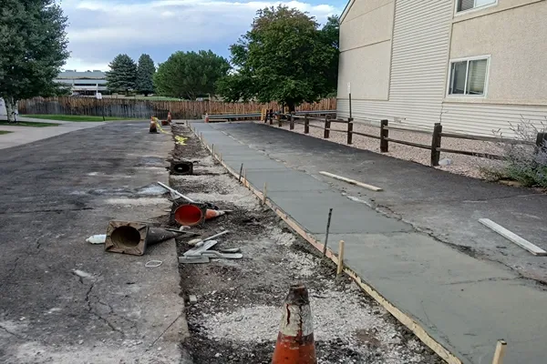 Formed concrete sidewalk beside an apartment complex in Colorado Springs