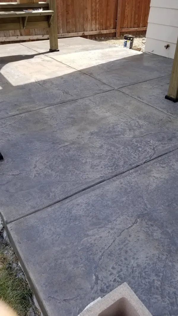 Gray slate-stamped concrete patio with saw-cut joints in Colorado Springs