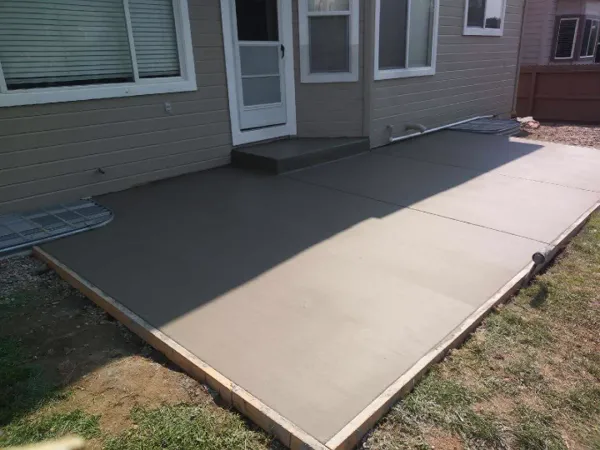 Freshly poured concrete backyard patio in Colorado Springs
