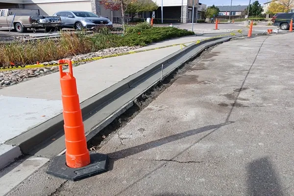 New concrete curb and gutter beside a sidewalk in Colorado Springs