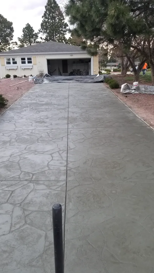 Long stamped flagstone concrete driveway in Colorado Springs