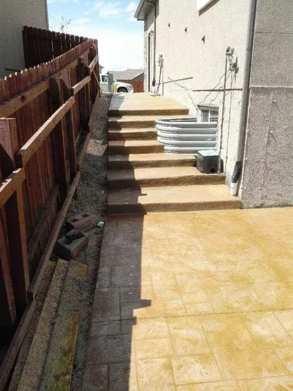 Stamped concrete overlay on side yard steps and walkway in Colorado Springs