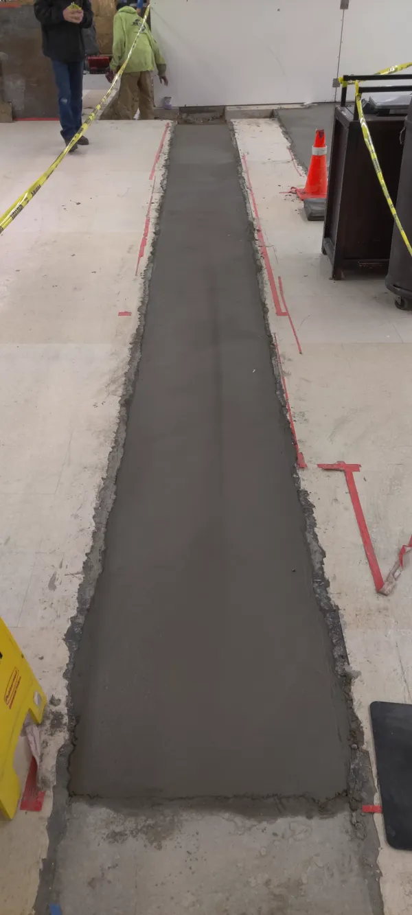 Flush concrete trench patch poured in a retail store floor in Colorado Springs